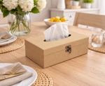 MDF DIY  tissue box on a table with a vase of flowers and a bowl of fruit in the background.