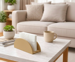Beige MDF DIY napkin holder with white napkins on a marble coffee table in a living room.