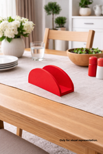 Red MDF DIY  napkin holder on a dining table with a neutral background