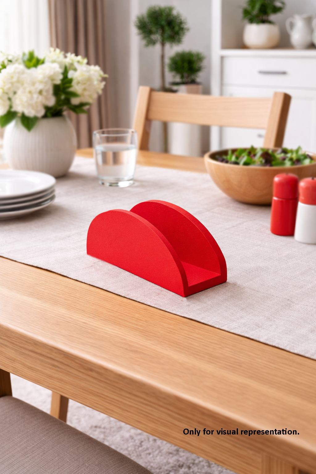 Red MDF DIY  napkin holder on a dining table with a neutral background