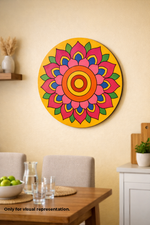 Colorful MDF DIY mandala wall art on a beige wall above a dining table.