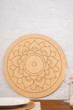 Round MDF DIY  mandala with floral design on a wooden table.