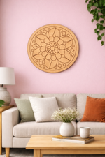 Decorative MDF DIY mandala wall art on a pink wall above a sofa with cushions.