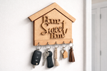 MDF key holder shaped like a house with 'Home Sweet Home' text, holding various keys.