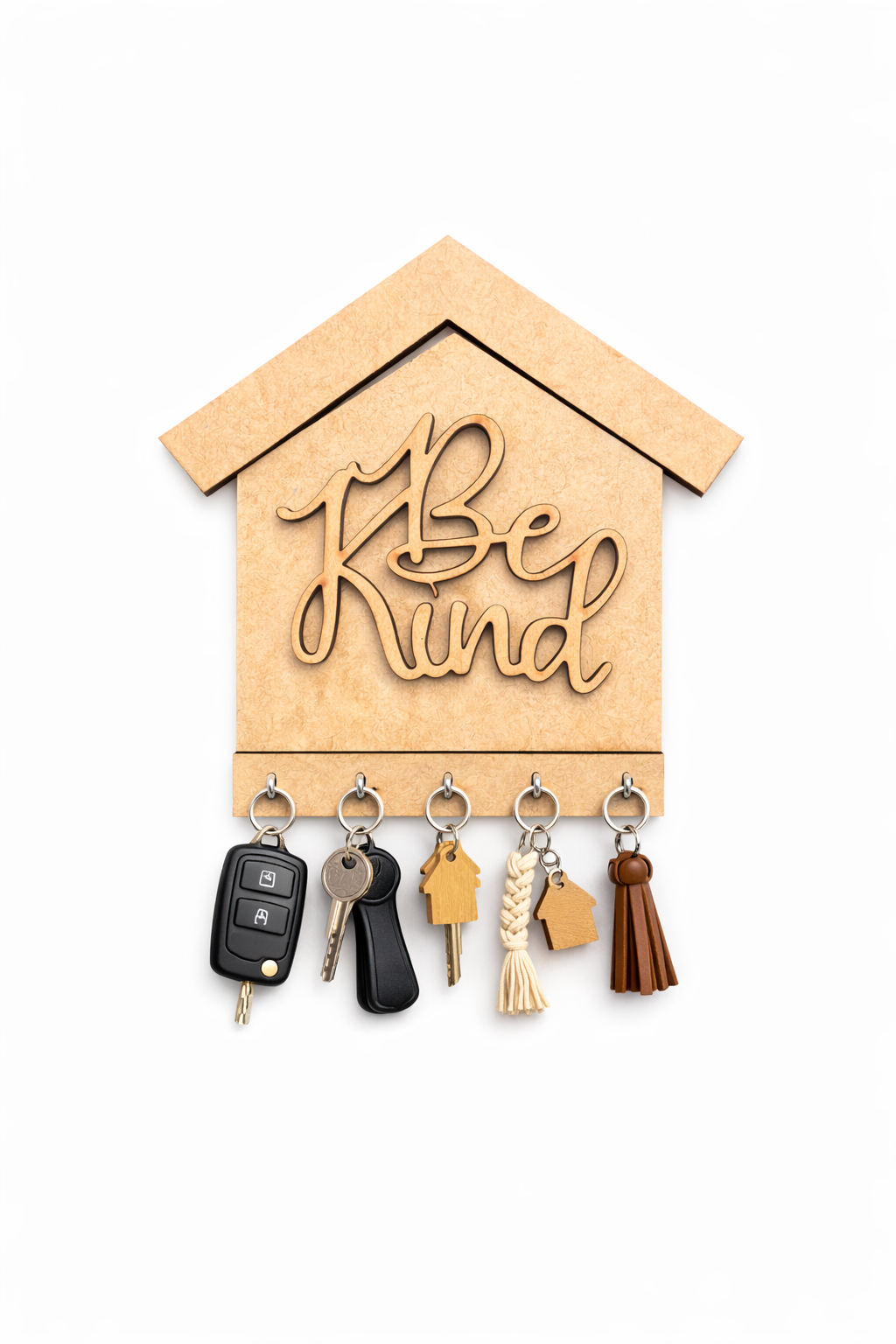 MDF DIY key holder shaped like a house with 'Be Kind' text and various keys attached on a white background.