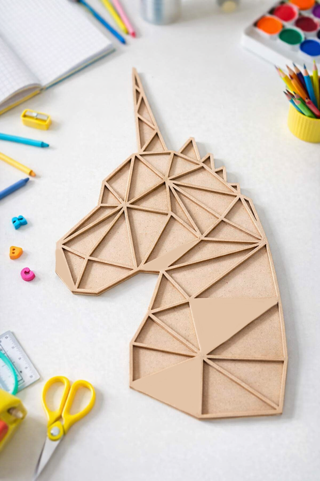 Unpainted DIY MDF geometric unicorn puzzle with detachable pieces for painting and craft activity show on craft table 