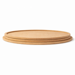 Plain round MDF DIY boards stacked together with smooth unpainted surface for painting, mandala art, and craft projects