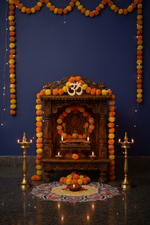 MDF Om symbol on wooden main door with rangoli and diyas decoration