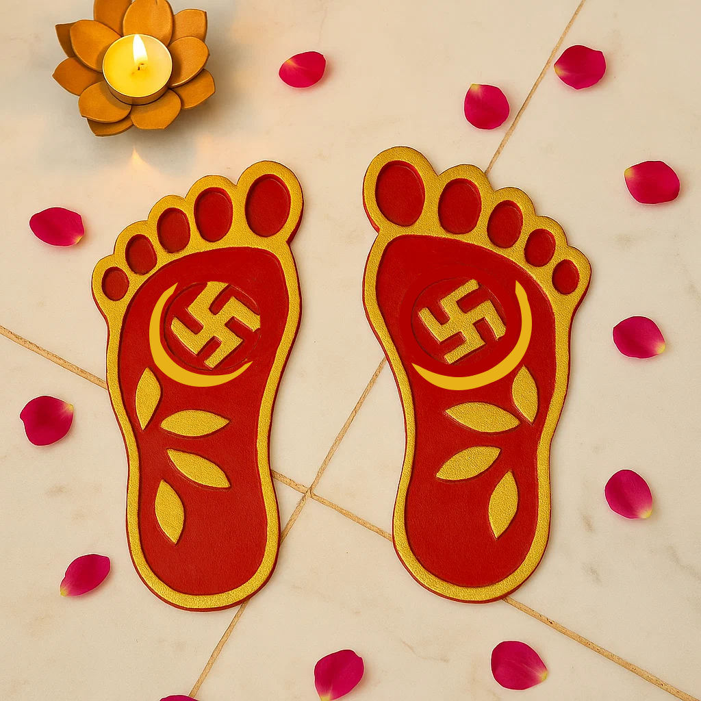 Red and gold footprints with a swastika symbol on a decorative background with candles and petals.
