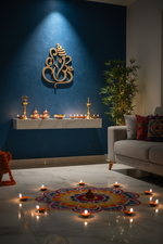 MDF Ganesha Om wall hanging on blue pooja room wall with rangoli and diyas