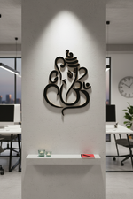 Black MDF Ganesha Om wall hanging in modern office under spotlight