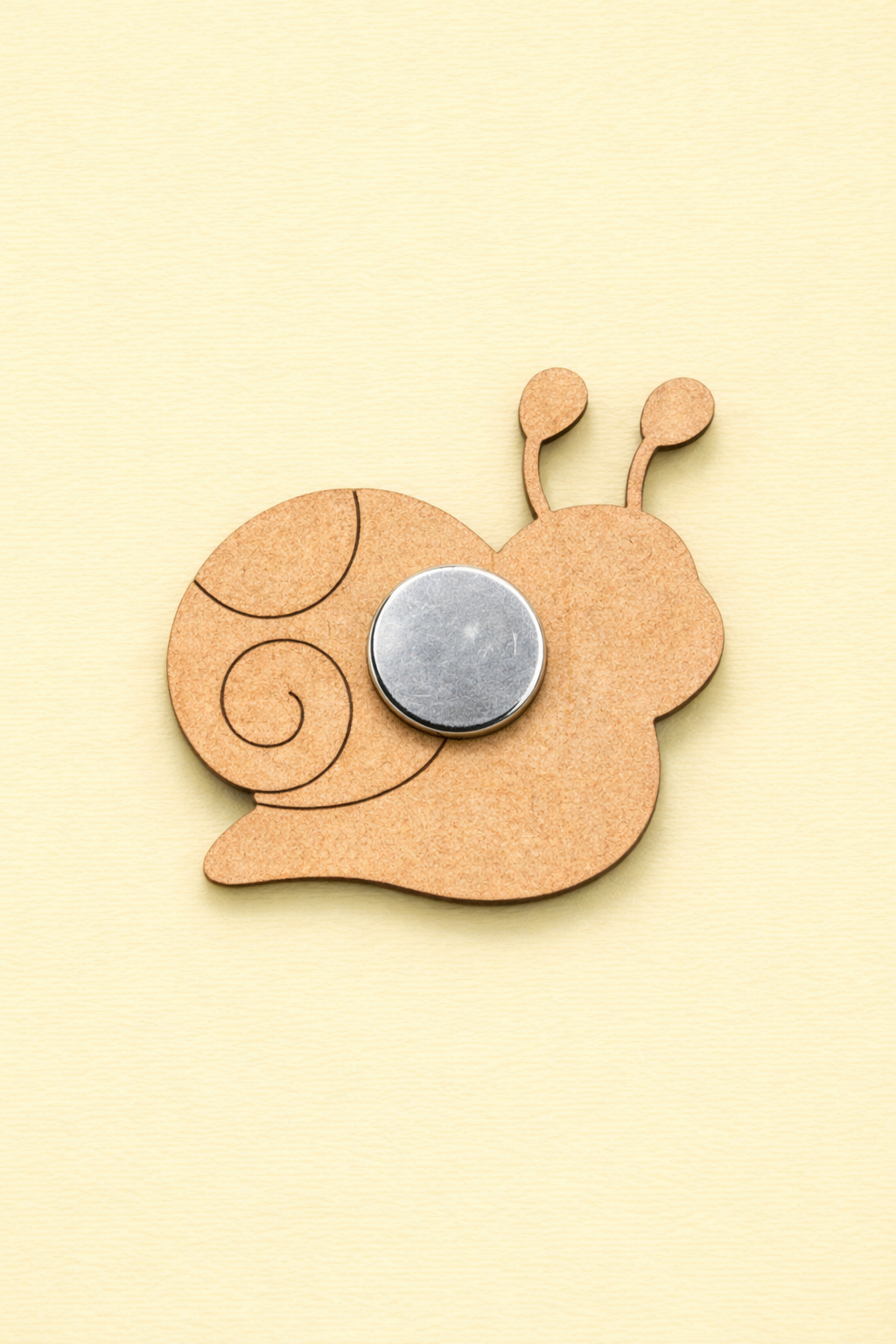 backside of MDF snail DIY fridge magnet unpainted craft cutout for home decor