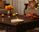 Decorative setup with DIY mdf candle holder and flowers on a wooden table, likely for a festive occasion.