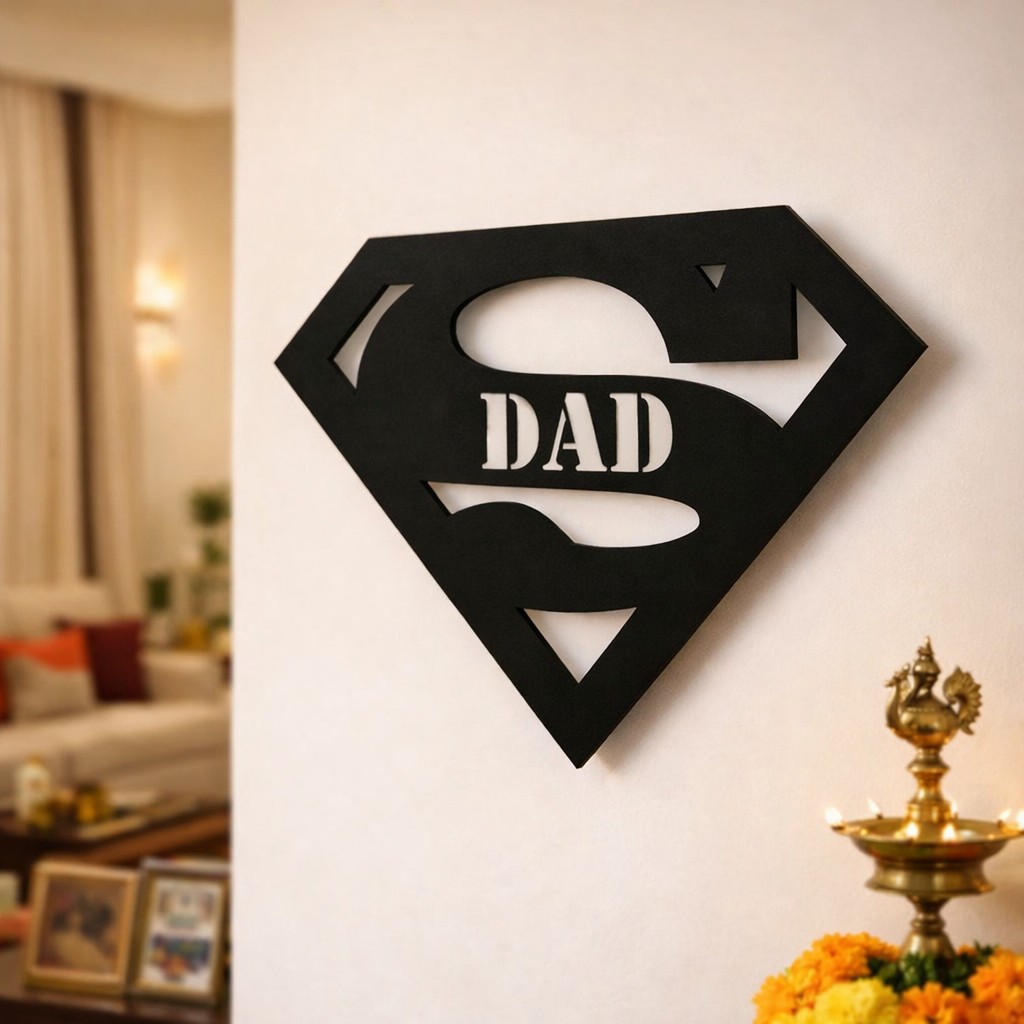Black superhero-style “Super Dad” wall décor mounted on a white wall in a modern living room interior.