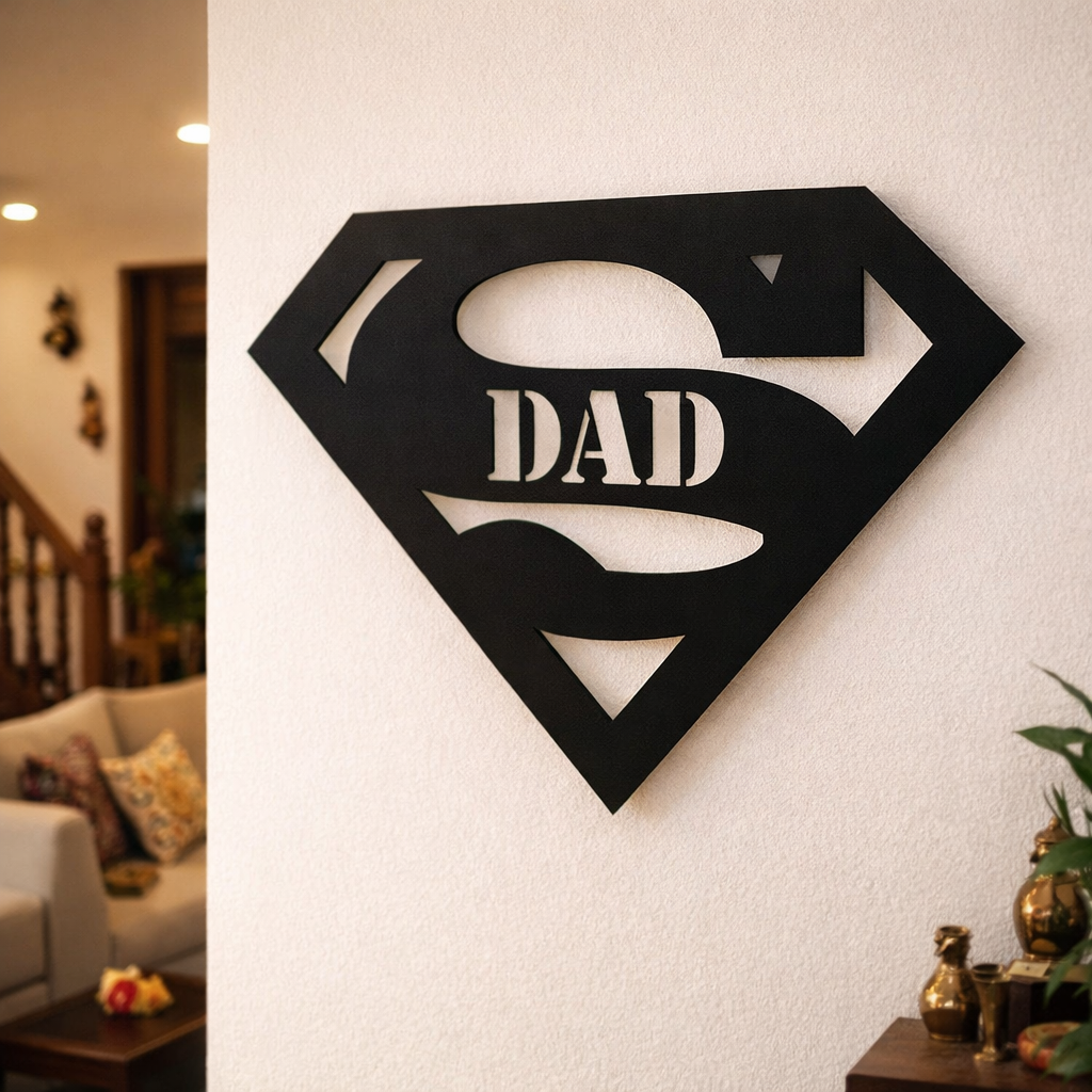 Black superhero-style “Super Dad” wall décor mounted on a white wall in a modern living room interior.