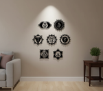 Seven chakra MDF wall decor set with spiritual symbols arranged symmetrically on a wall in a modern meditation space.