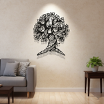 Tree of Life MDF wall decor with intricate laser-cut design mounted on a wall in a modern living room interior.