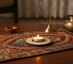 Candle and incense sticks on a decorative mat with a blurred background with mdf tea light candle holder.