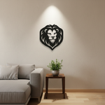 Black MDF lion face wall décor mounted on a beige wall above a sofa with a small wooden side table and plant.