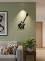 Decorative guitar MDF wall decor with musical design mounted on a light wall in a modern living room interior.