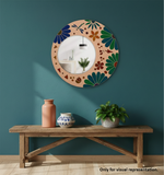 Decorative mirror with floral pattern on a teal wall above a wooden bench with vases and a plant.