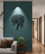 Tree of life MDF wall decor featuring a detailed tree silhouette mounted on a light wall in a modern living room.