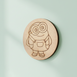 Round MDF pre-marked base with Minion-inspired cartoon character painted in yellow and blue for kids craft.