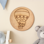 Plain MDF base with pre-marked design of a bear in a hot air balloon for DIY painting.