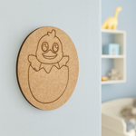Unpainted round MDF pre-marked chick in egg base for DIY kids painting and craft.