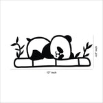 Adorable black MDF panda wall decor featuring a sleeping panda on bamboo with leaves, this dimensional image of the product shows 4.8 inch by 12 inch dimensions of the product.