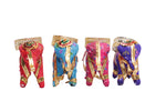 Vibrant elephant candle stands in red, blue, pink, and purple adorned with golden detailing and intricate patterns, perfect for adding a traditional touch to decor