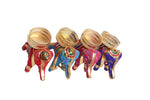 Multicolor elephant-shaped diya candle holders arranged in a set for festival decoration