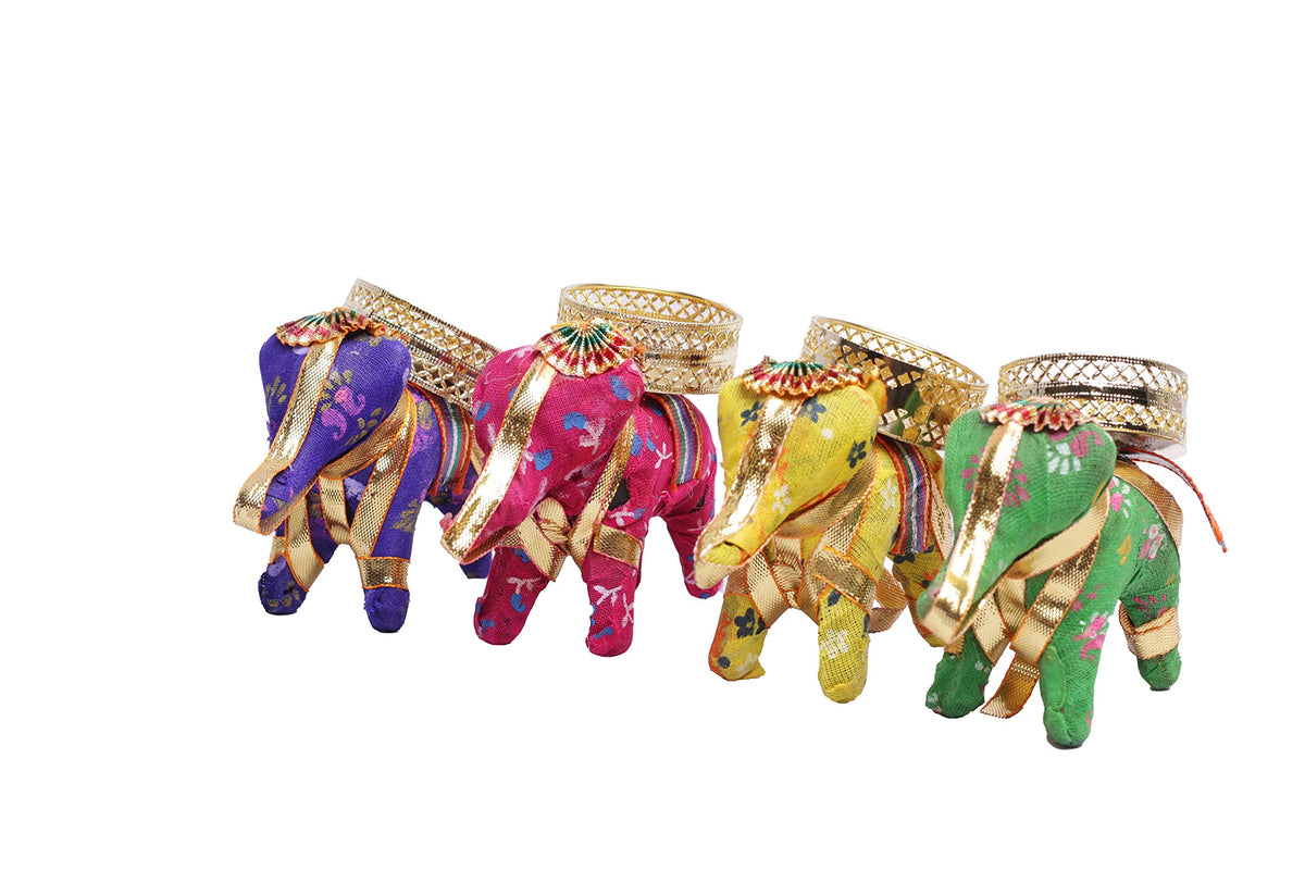 Vibrant elephant candle stands in red, blue, pink, and purple adorned with golden detailing and intricate patterns, perfect for adding a traditional touch to decor. Set of 4 pieces.