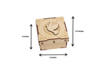 Top view of wooden MDF bird box with intricate dove engraving and floral details

