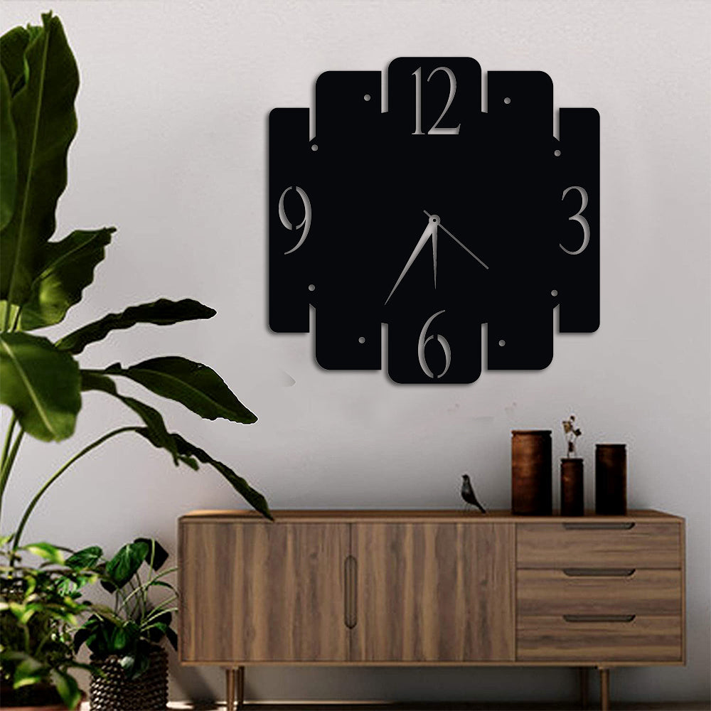 Modern black wall clock with a unique geometric design, featuring minimalist numbers and sleek hands.