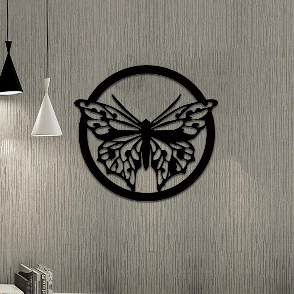 Black butterfly wall decor featuring a detailed butterfly design within a circular frame, mounted on a textured gray wall in a modern interior space.