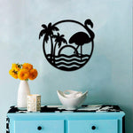 Round flamingo wall art featuring palm trees, sunset, and waves in a minimalist black design on a light blue wall.