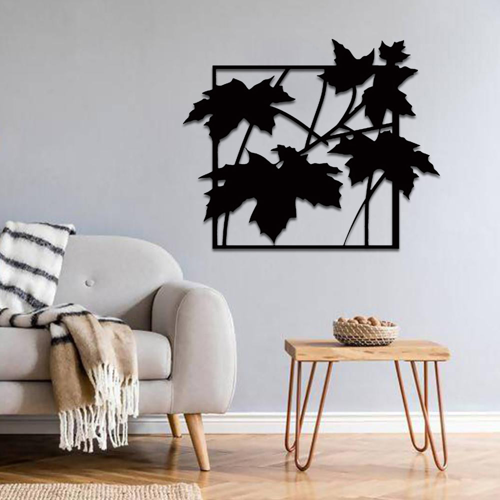 Elegant black mdf leaf-patterned wall art displayed in a modern living room, adding a touch of natural sophistication