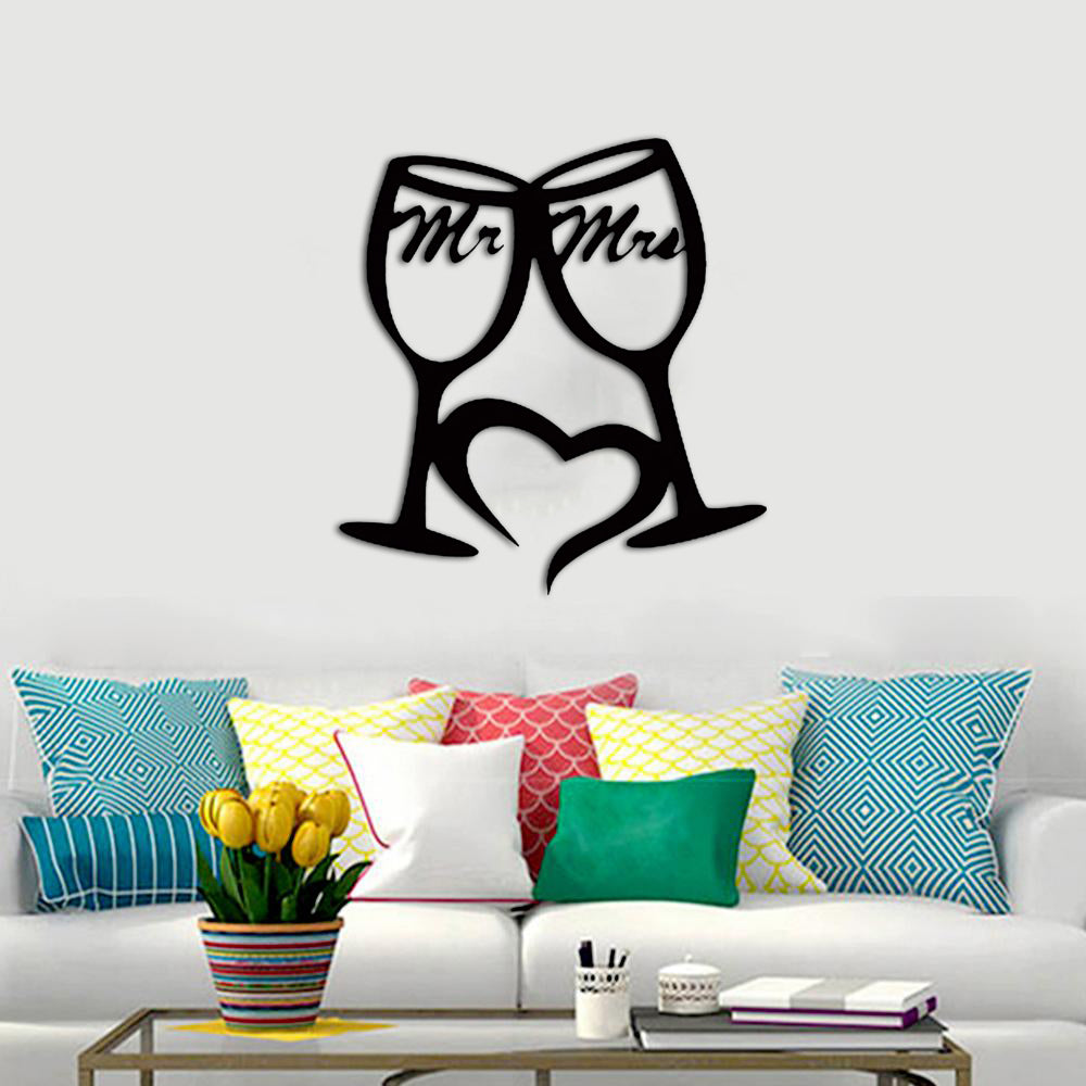 Romantic Mr. and Mrs. wall art featuring clinking wine glasses and a heart design displayed above a colorful sofa.