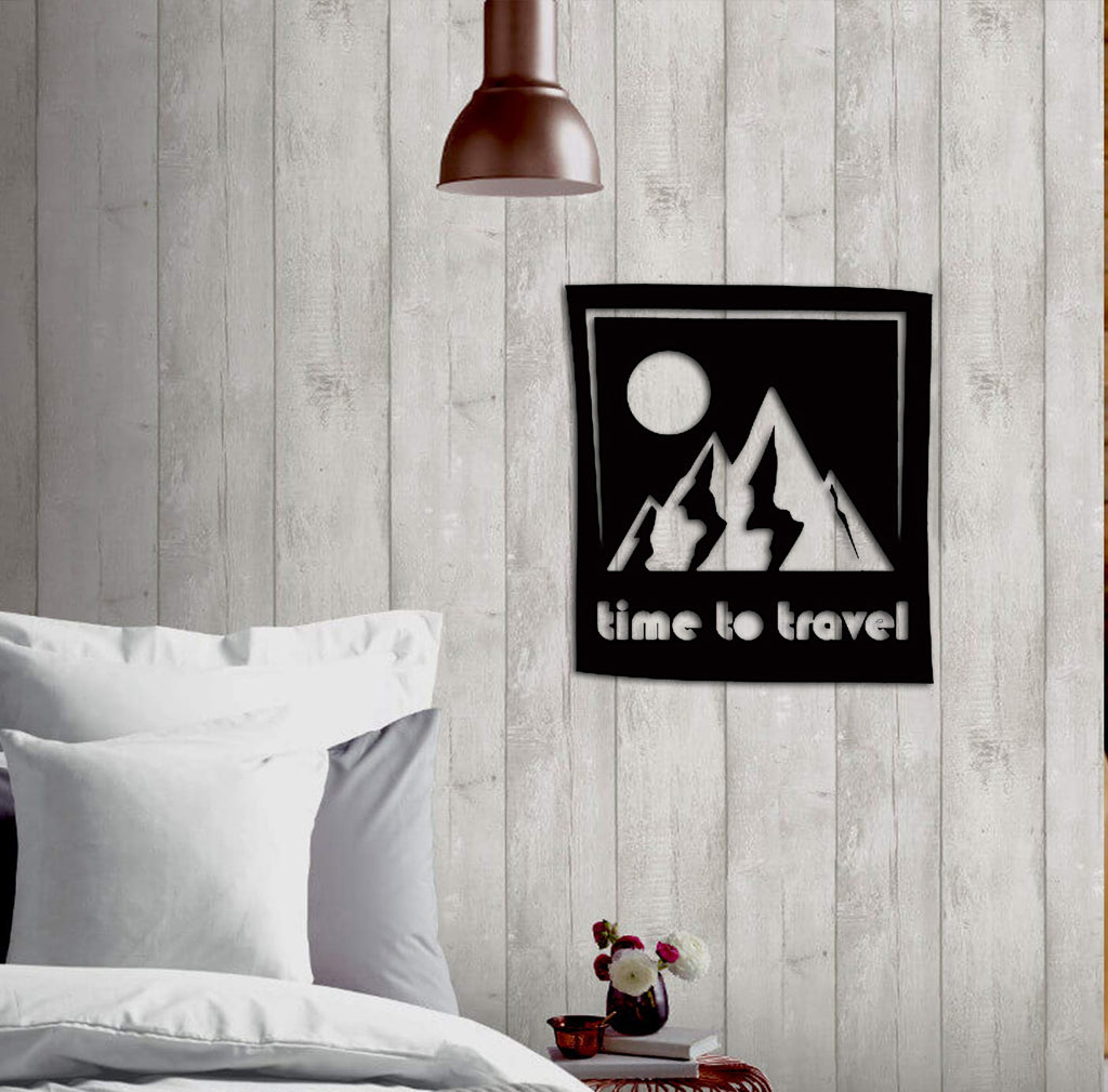 Travel-themed wall art with a mountain design and 'Time to Travel' text displayed in a cozy bedroom with wooden walls.