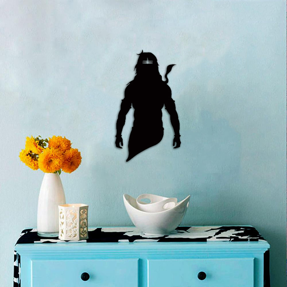 Black God Shambhu wall art featuring a powerful silhouette of Lord Shiva, mounted on a light blue wall above a decorative table with vibrant flowers.