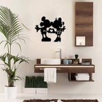 Romantic couple silhouette wall art featuring a playful design displayed in a modern bathroom with wooden decor.