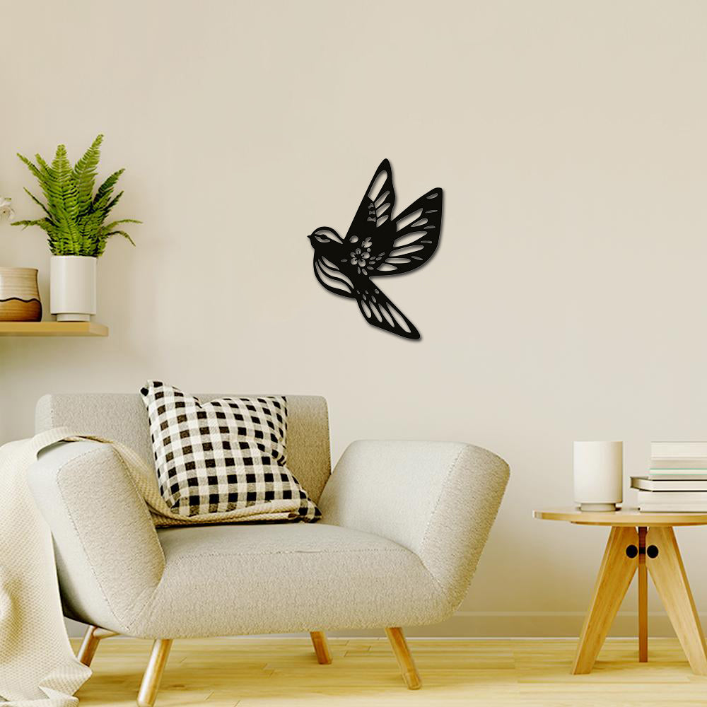 Elegant black pigeon wall art decor mounted on a neutral living room wall.