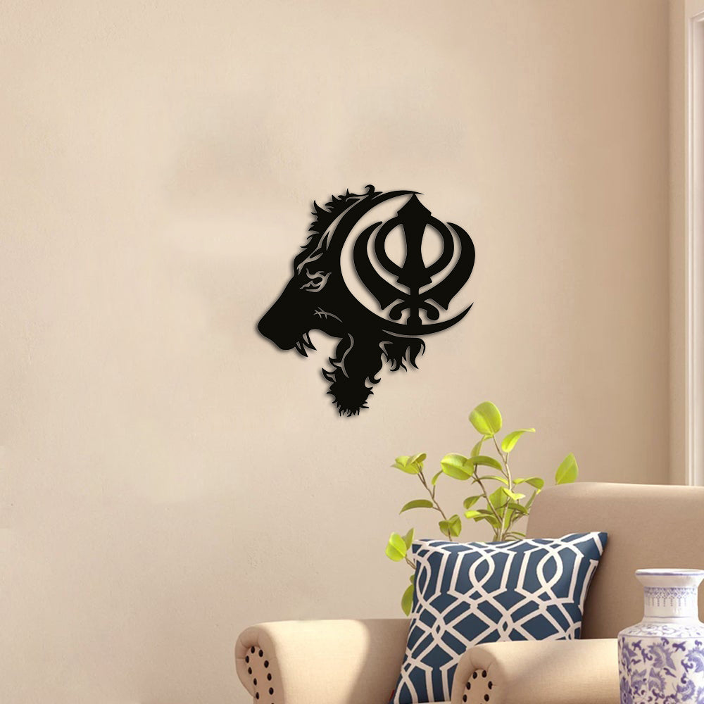 Black MDF wall art featuring a lion's profile with a Khalsa symbol, mounted on a beige wall above a cozy armchair with decorative cushions and a green plant.