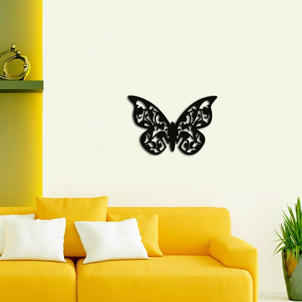 Elegant butterfly-shaped MDF wall decor with intricate patterns, adding charm to a vibrant living room interior