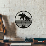 Minimalist sea beach wall art featuring palm trees within a circular frame on a white brick wall.