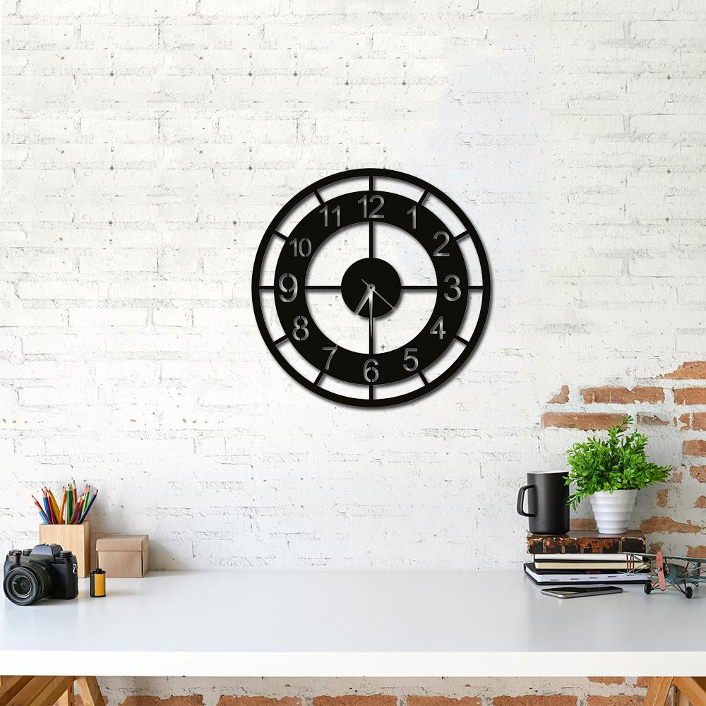 Modern digits wall clock with a minimalist design, featuring bold numerals, mounted on a rustic white brick wall above a clean desk setup.