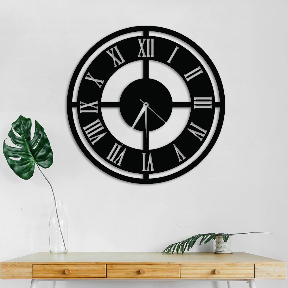 Black Roman numeral wall clock with an open-frame design mounted on a white wall above a wooden console table with decorative plants.