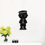 Black MDF wall art of a sailor boy with an anchor design, perfect for nautical-themed decor.