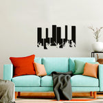 Modern black piano keys wall art decor in a stylish living room with a colorful sofa